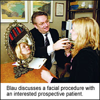Dr Blau discusses a facial procedure with patient